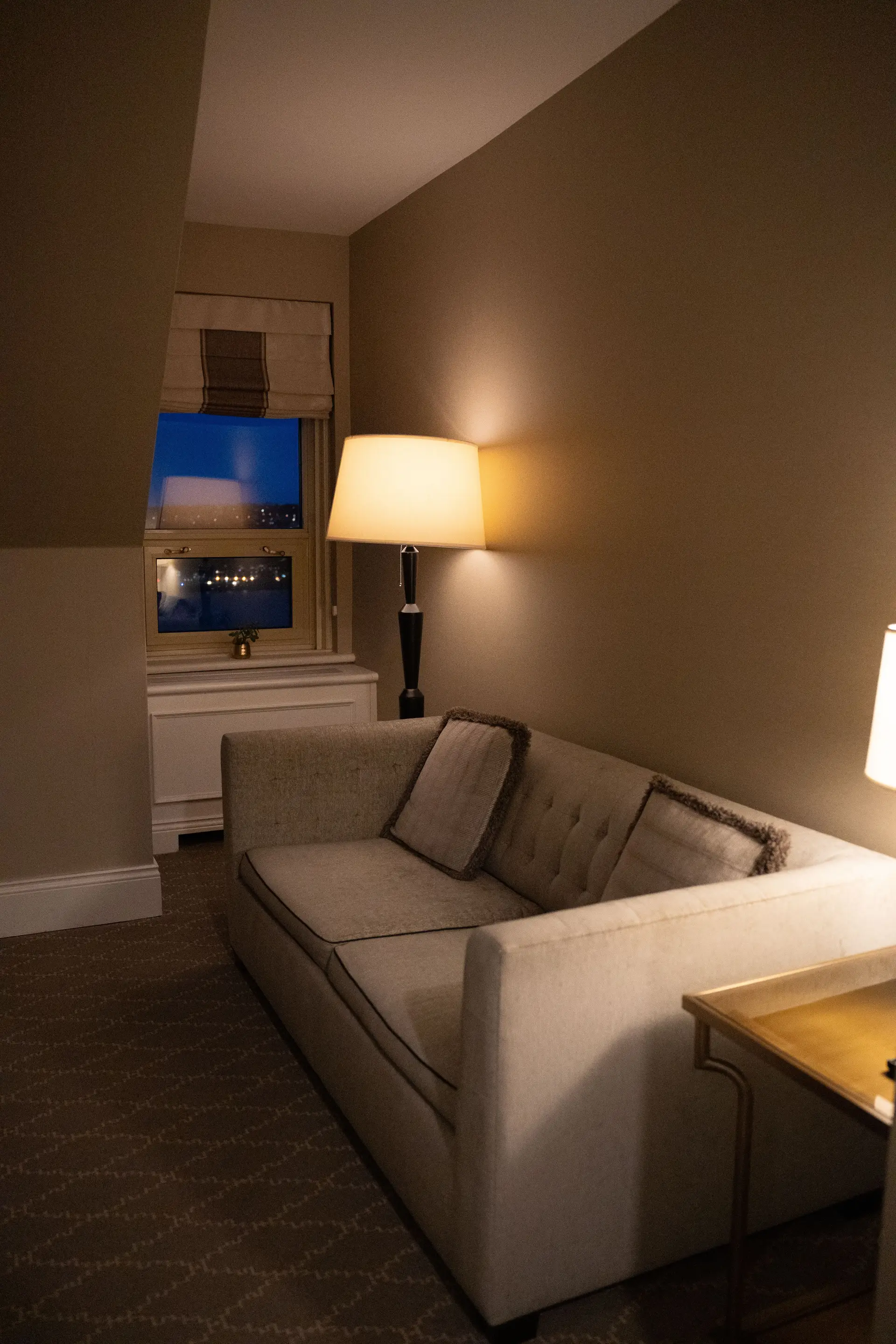 Elegant hotel suite lounge area with city views
